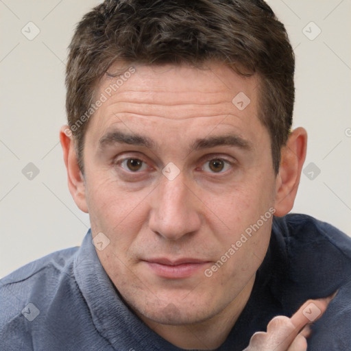 Joyful white adult male with short  brown hair and brown eyes