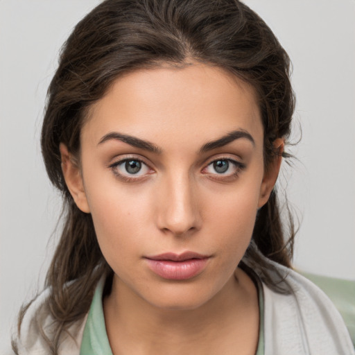 Neutral white young-adult female with medium  brown hair and brown eyes