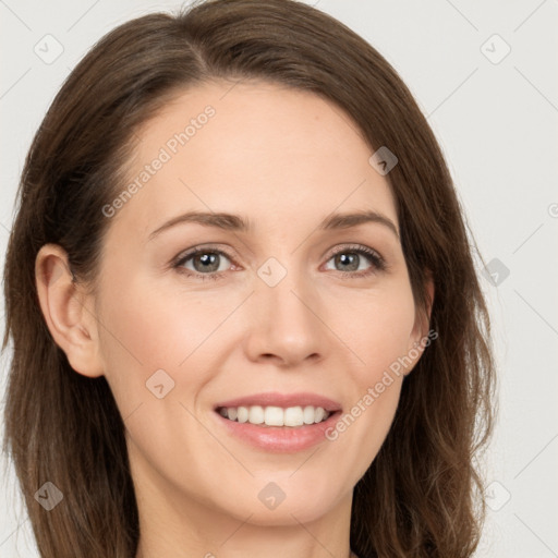 Joyful white young-adult female with long  brown hair and brown eyes