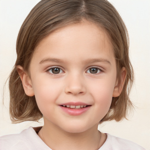 Joyful white child female with medium  brown hair and brown eyes