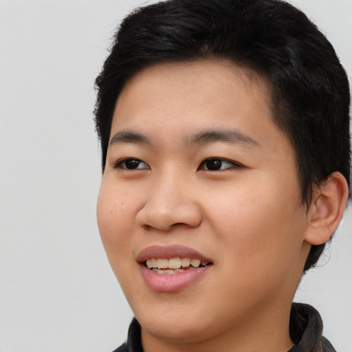 Joyful asian young-adult male with long  black hair and brown eyes