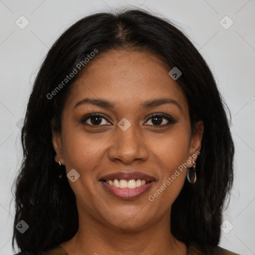 Joyful black young-adult female with long  brown hair and brown eyes