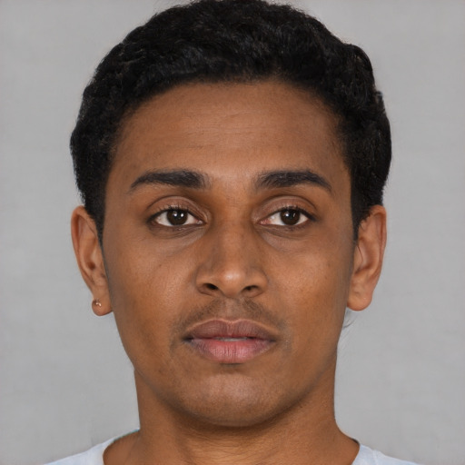 Neutral black young-adult male with short  black hair and brown eyes