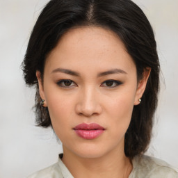 Neutral asian young-adult female with medium  brown hair and brown eyes