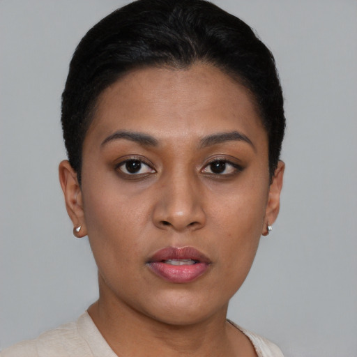 Neutral black young-adult female with short  brown hair and brown eyes