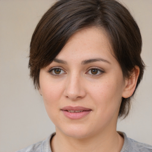 Joyful white young-adult female with medium  brown hair and brown eyes