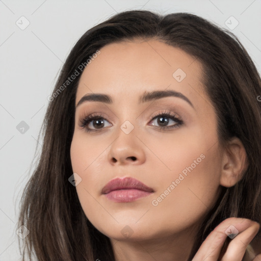 Neutral white young-adult female with long  brown hair and brown eyes