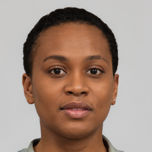 Joyful black young-adult female with short  brown hair and brown eyes
