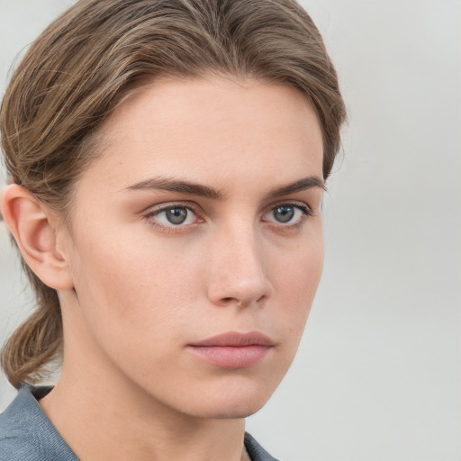 Neutral white young-adult female with medium  brown hair and blue eyes