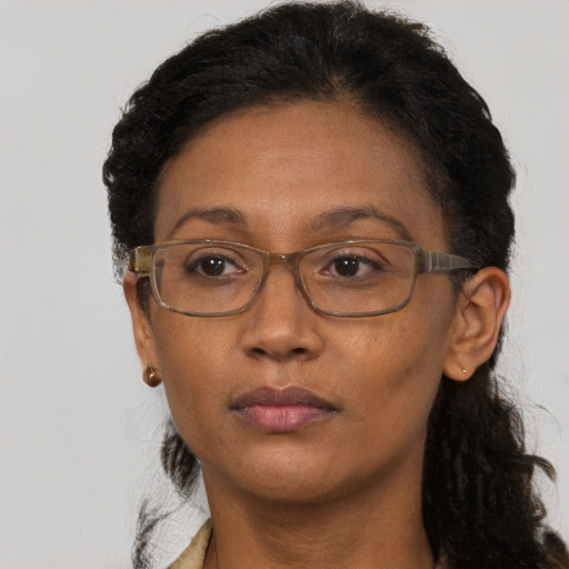 Neutral black adult female with medium  brown hair and brown eyes