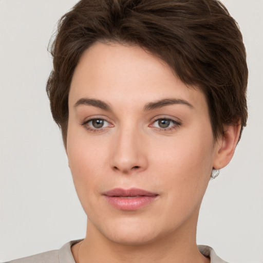 Neutral white young-adult female with short  brown hair and brown eyes