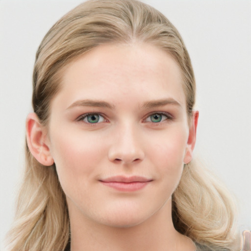 Joyful white young-adult female with long  brown hair and blue eyes