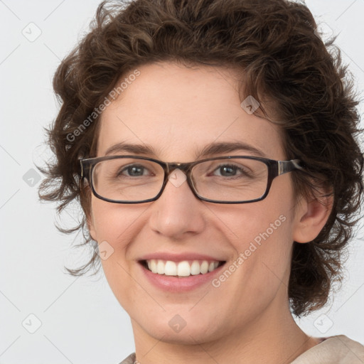 Joyful white young-adult female with medium  brown hair and green eyes