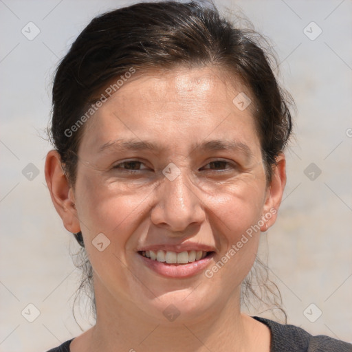 Joyful white adult female with medium  brown hair and brown eyes