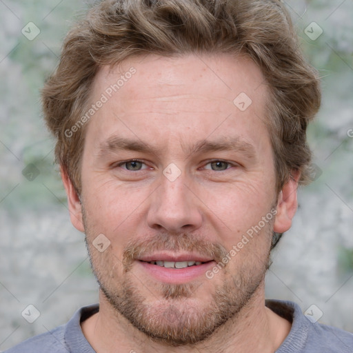 Joyful white adult male with short  brown hair and grey eyes