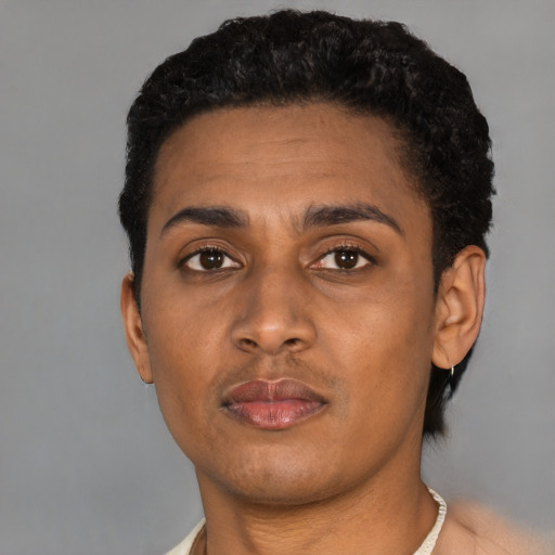 Neutral latino young-adult male with short  brown hair and brown eyes