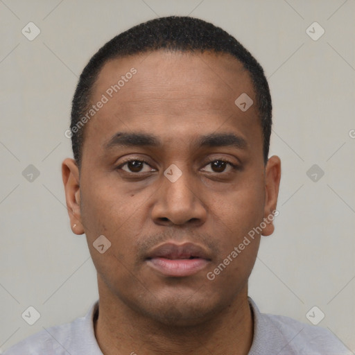 Neutral latino young-adult male with short  black hair and brown eyes