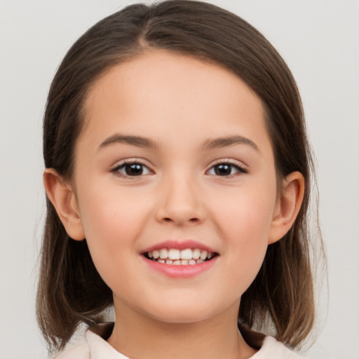 Joyful white child female with medium  brown hair and brown eyes