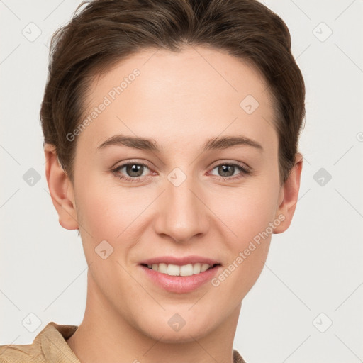 Joyful white young-adult female with short  brown hair and grey eyes