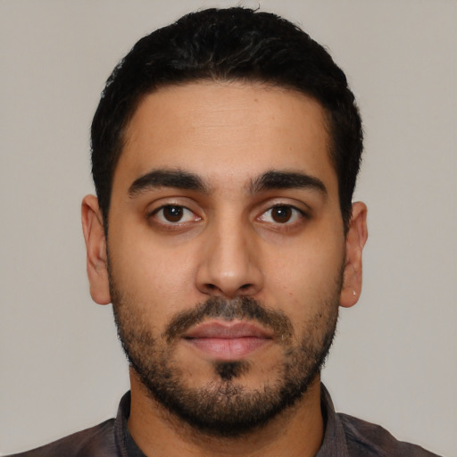 Neutral latino young-adult male with short  black hair and brown eyes