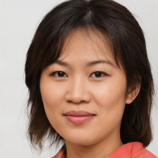Joyful white young-adult female with medium  brown hair and brown eyes