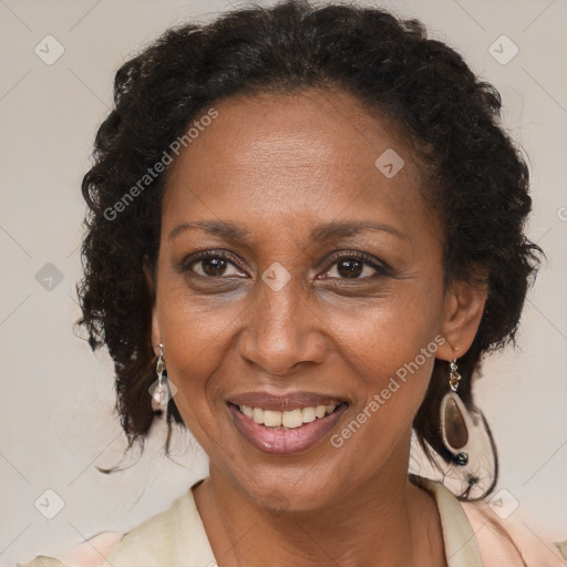 Joyful black adult female with medium  brown hair and brown eyes