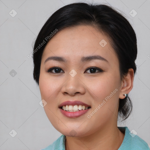 Joyful asian young-adult female with medium  black hair and brown eyes