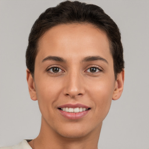 Joyful white young-adult female with short  brown hair and brown eyes