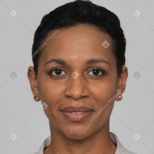 Joyful black young-adult female with short  black hair and brown eyes