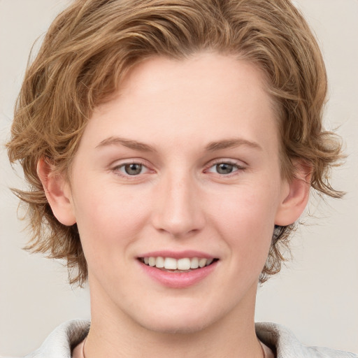 Joyful white young-adult female with medium  brown hair and blue eyes