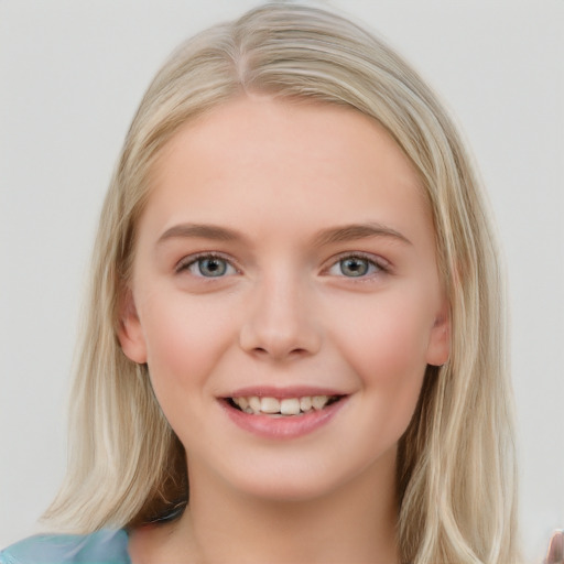 Joyful white young-adult female with medium  brown hair and blue eyes