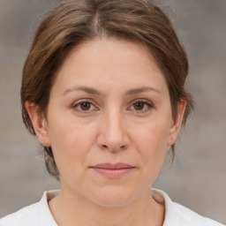 Joyful white adult female with medium  brown hair and brown eyes