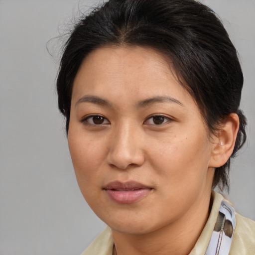 Joyful asian young-adult female with medium  brown hair and brown eyes