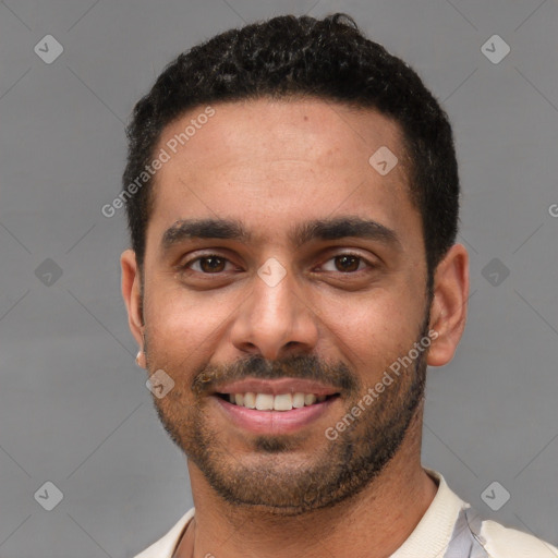 Joyful white young-adult male with short  black hair and brown eyes