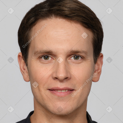 Joyful white adult male with short  brown hair and grey eyes