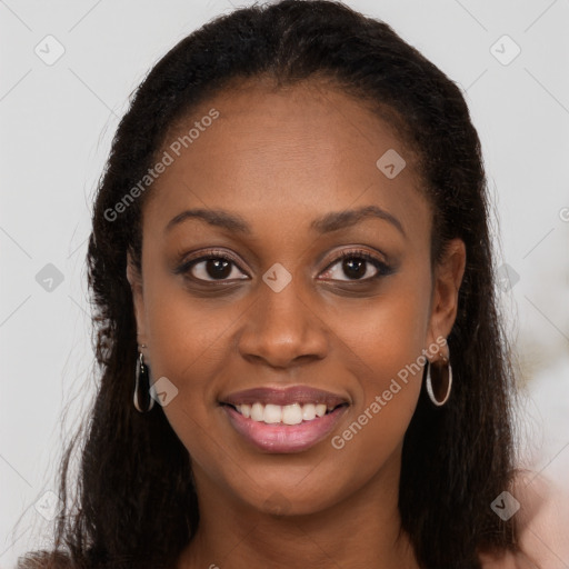 Joyful black young-adult female with long  brown hair and brown eyes