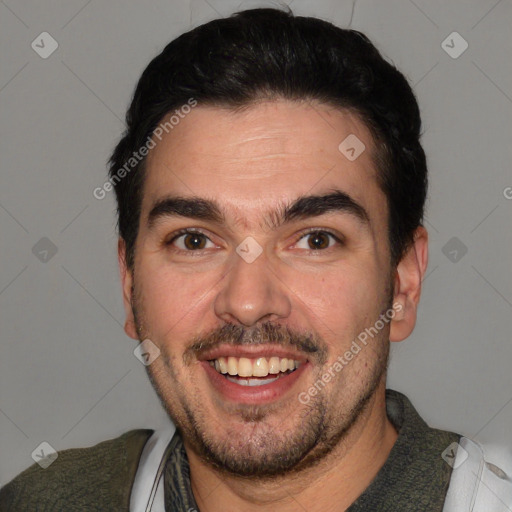 Joyful white adult male with short  black hair and brown eyes