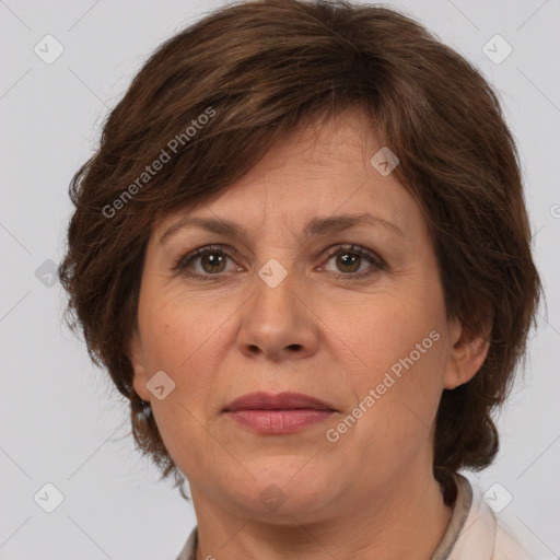 Joyful white adult female with medium  brown hair and brown eyes