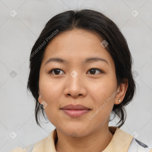 Joyful asian adult female with medium  brown hair and brown eyes