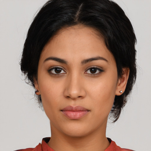 Neutral latino young-adult female with medium  brown hair and brown eyes