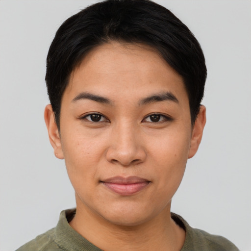 Joyful asian young-adult female with short  black hair and brown eyes