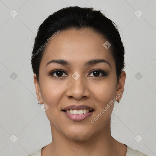 Joyful latino young-adult female with short  black hair and brown eyes