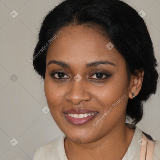 Joyful black young-adult female with medium  black hair and brown eyes