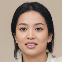 Joyful asian young-adult female with medium  black hair and brown eyes