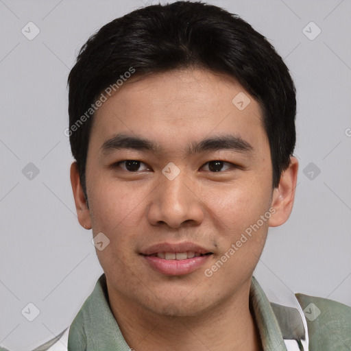 Joyful white young-adult male with short  black hair and brown eyes