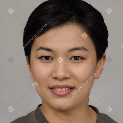 Joyful asian young-adult female with short  black hair and brown eyes