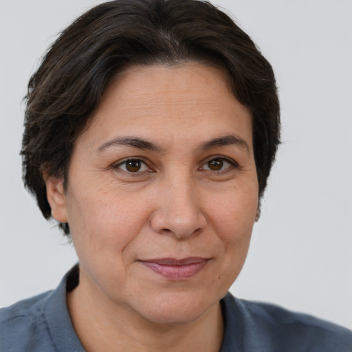 Joyful white adult female with short  brown hair and brown eyes