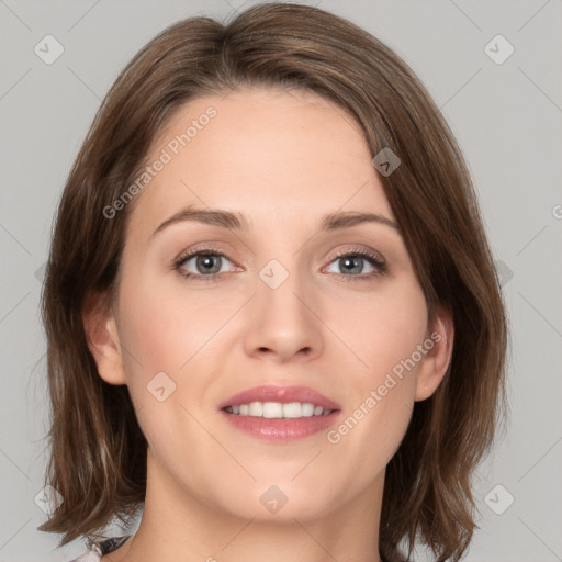 Joyful white young-adult female with medium  brown hair and green eyes