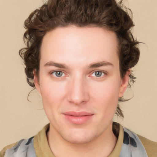 Joyful white young-adult male with medium  brown hair and brown eyes