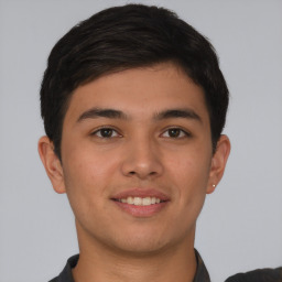 Joyful asian young-adult male with short  brown hair and brown eyes